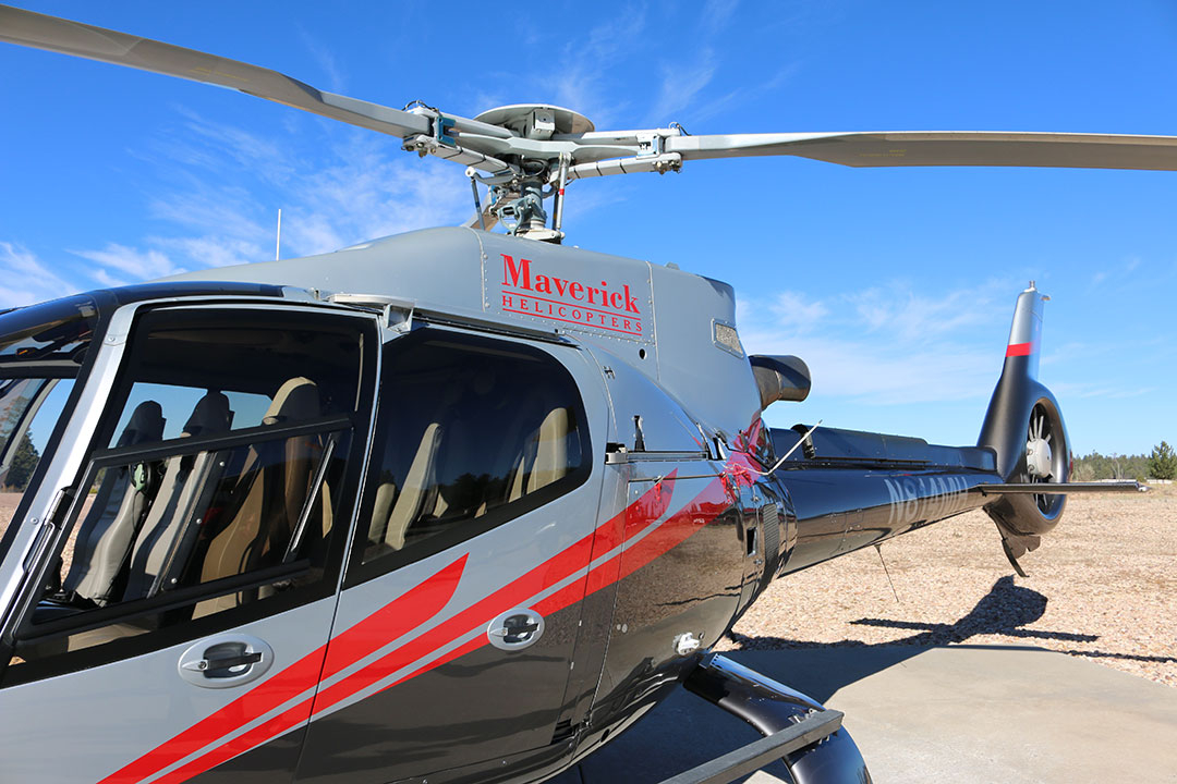 The Maverick Helicopter at the Grand Canyon on a bright blue sky day