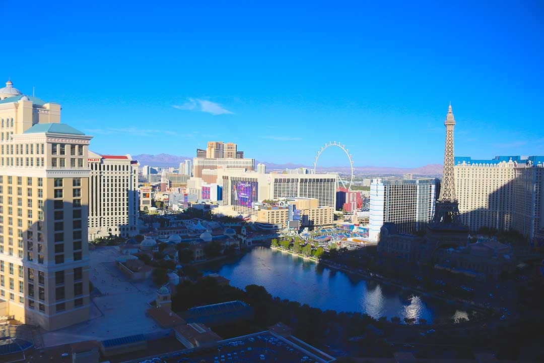 View from our hotel room on a perfect blue sky day of Vegas during the day with beige coloured buildings