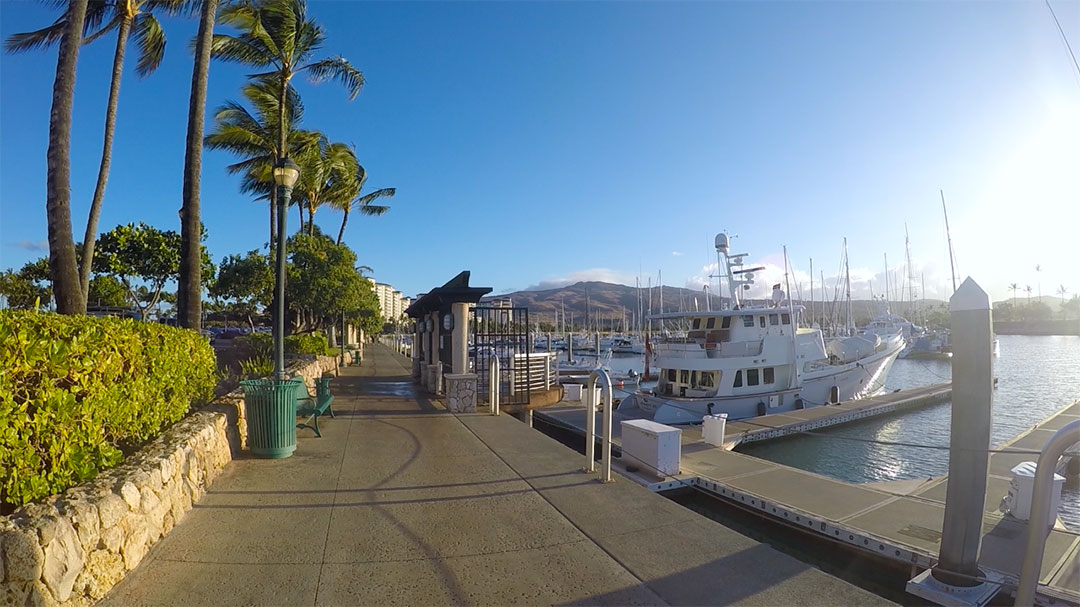 View of the pier in the morning on a perfect sunny day with boats in the harbour