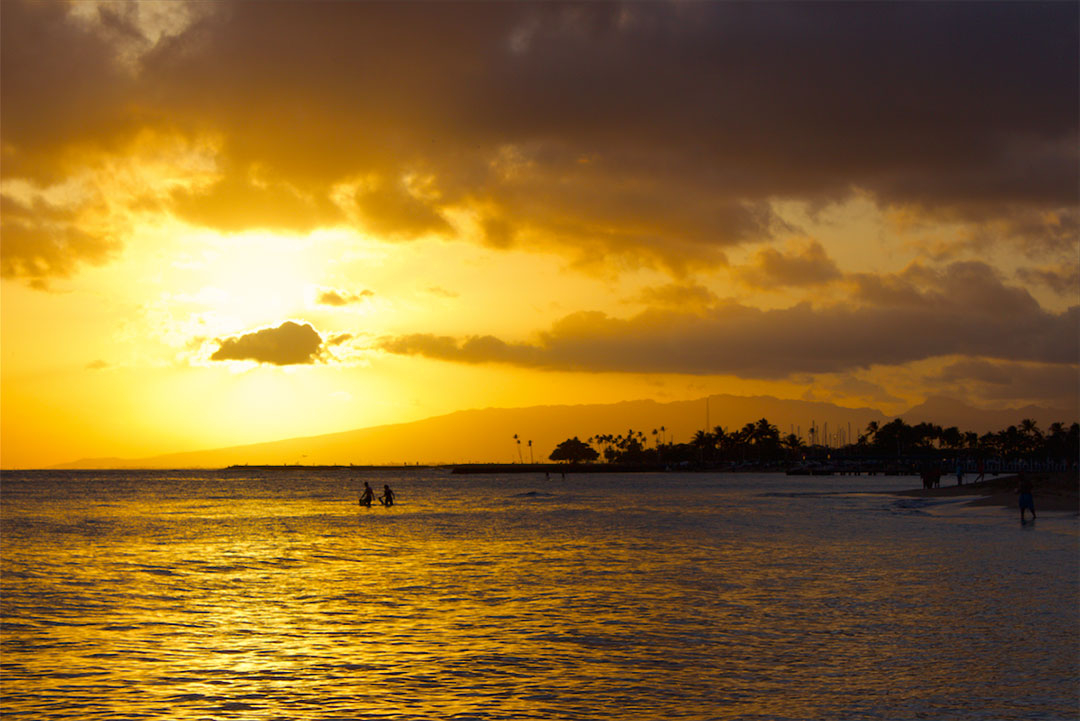 Beautiful golden sunset over Waikiki Beach in Hawaii