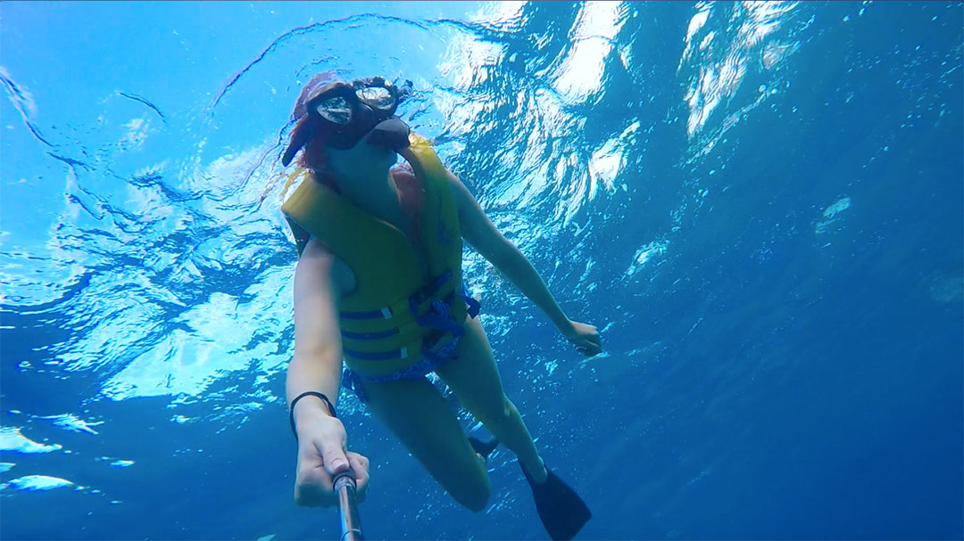 Me snorkelling in the ocean looking for wild dolphins and fish in Hawaii