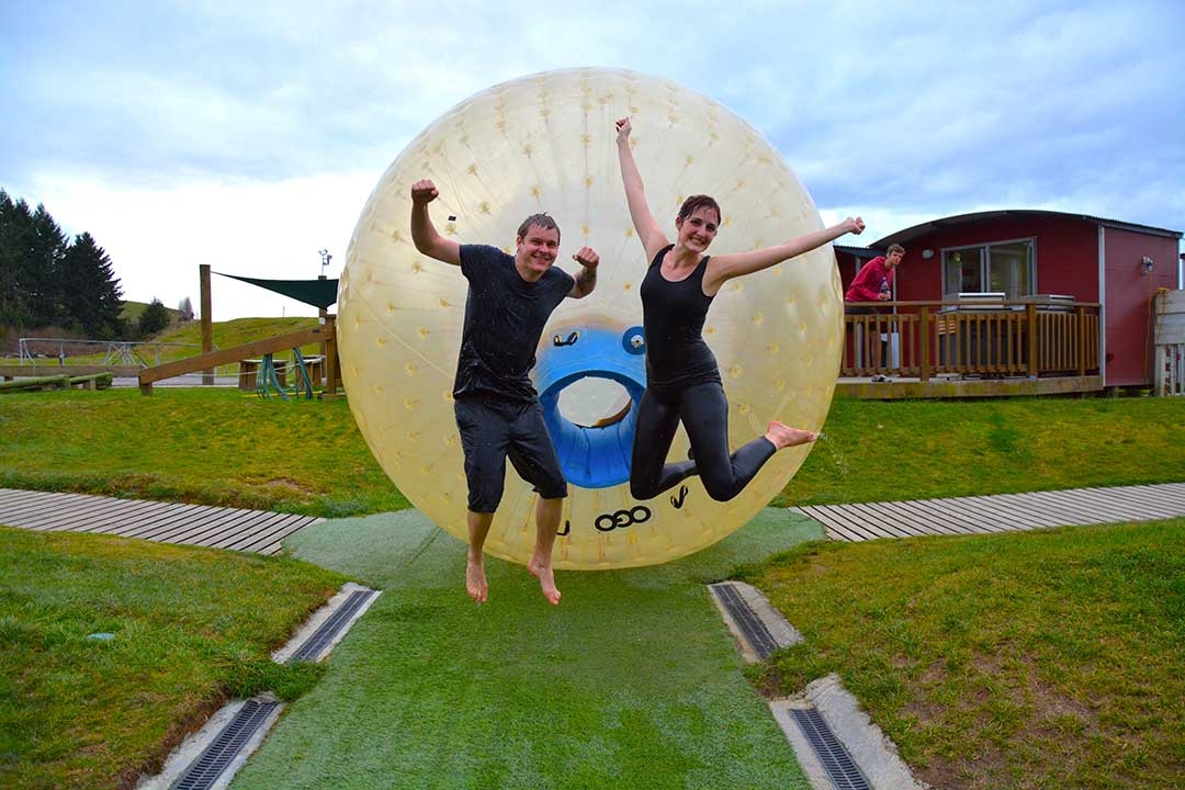 Casey and I jumping for joy in front of the OGO Sorbing ball on a cold winters day in Rotorua, New Zealand