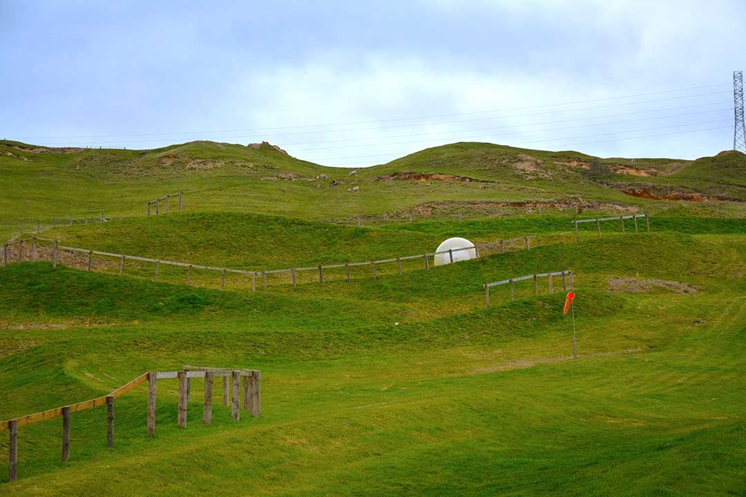 Our OGO zorbing ball rolling down the grassy zigzag path in Rototua, New Zealand