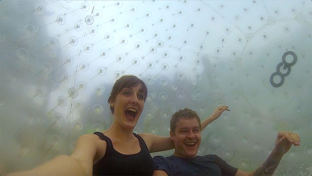 Casey and I inside the OGO Zorbing ball looking excited as speed pick up while we roll down the zigzag path on the hill