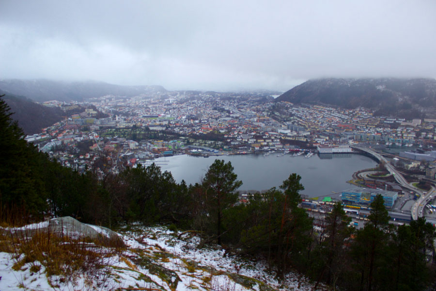 View of Bergen and the port from the top of the funicular, covered in snow on a cloudy winter day in Norway