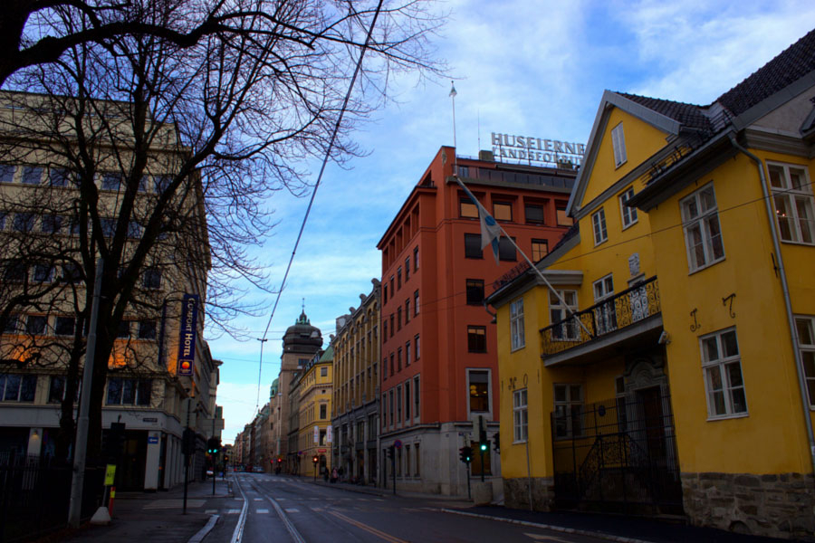 Walking the streets of Oslo, Norway on a beautiful winter day past bare trees and colourful buildings