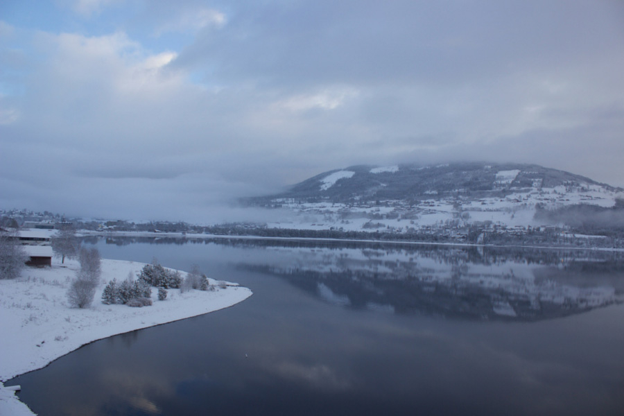 Mountain reflections in Voss, Norway on a snowy winter day