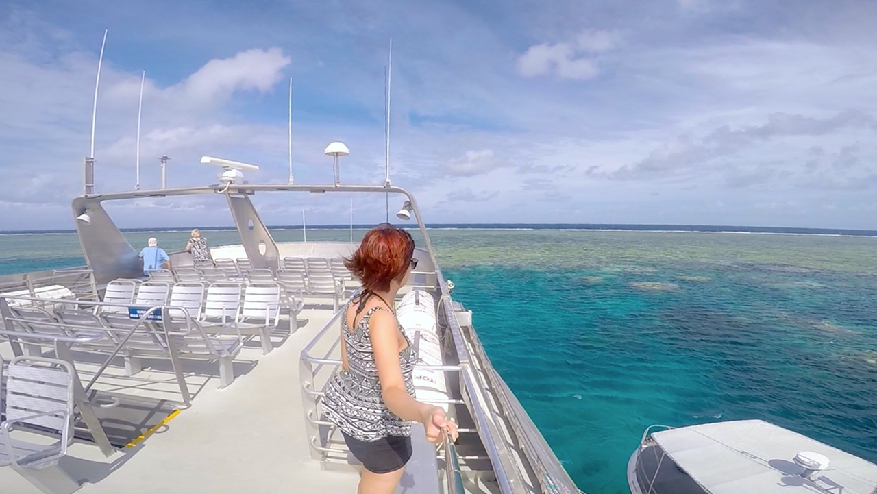 Me standing on the top level of the boat overlooking the coral of the Great Barrier Reef