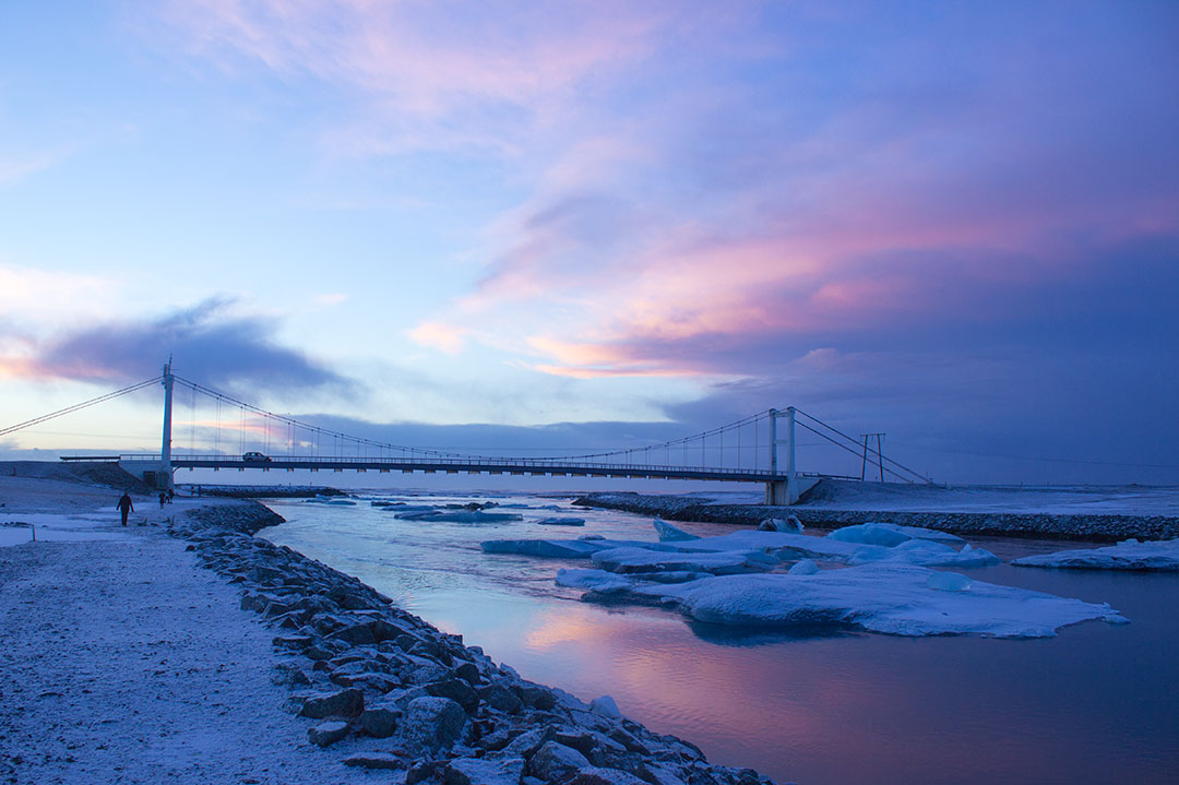 Jokulsarlon Glacier Lagoon at sunrise with pink skies and icebergs