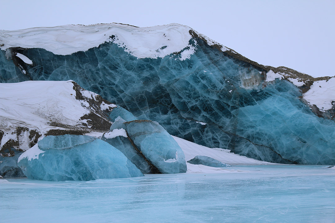 Blue frozen lakes in the Arctic in Svalbard